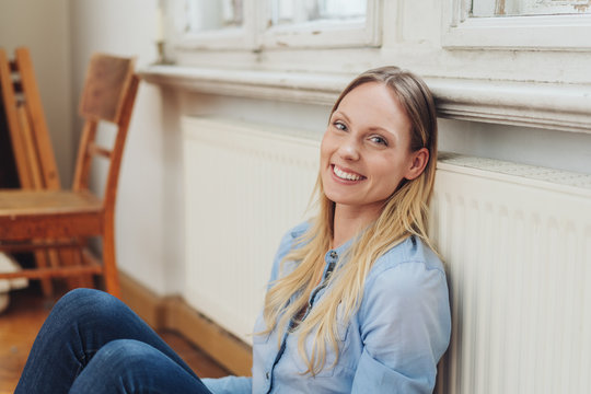 Happy friendly woman relaxing in the warmth