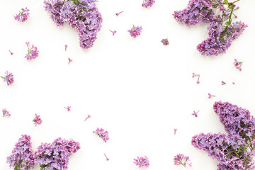 Lilac flowers on white background. Flat lay, top view