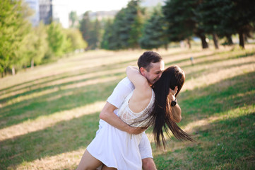 Fototapeta premium A love story in a fairy forest with a guy and a girl. Youth in nature.