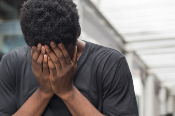 african man with face palm gesture stress or depression; portrait of depressed face palm african...
