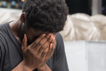african man with face palm gesture stress or depression; portrait of depressed face palm african...