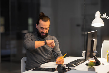 deadline, technology and people concept - creative man with smartwatch using voice command recorder...