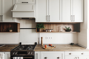 Modern Kitchen design in scandinavian style. stylish light grey kitchen interior with modern...
