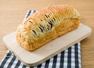 Sliced Raisin Bread on A Wooden Cutting Board