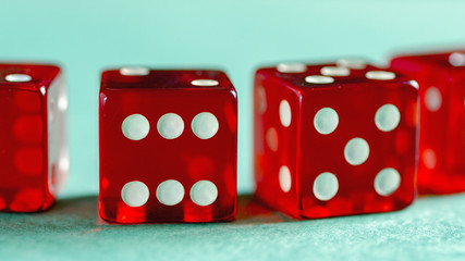 Red glass dices rendered on green background