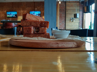Slices of rye bread fried in oil with salt, garlic and sour cream sauce
