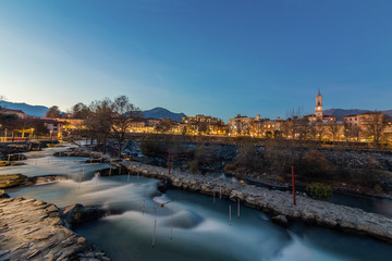 Fototapeta na wymiar An evening Blue Hour in Ivrea Piemonte Italy canoe Stadium