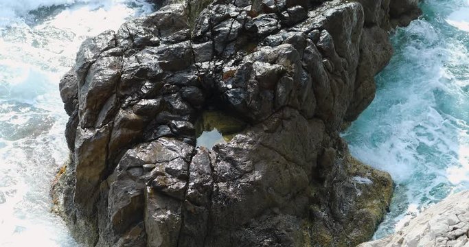 Blue Sea Waves Makes White Foam And Crashing On The Big Rock