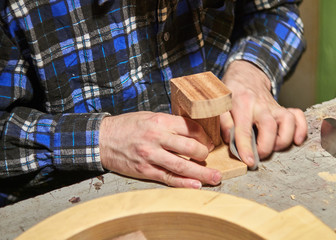 The process of making a classical guitar. Preparing to install the neckblock.