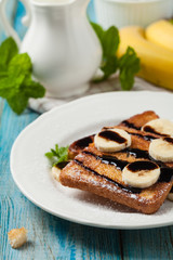 Traditional, delicious, sweet French toast with fruit and butter.