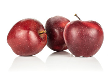 Group of three red delicious apples isolated on white background.