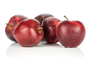Five red delicious apples isolated on white background.