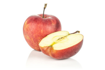 One red delicious apple and a half isolated on white background cross section.