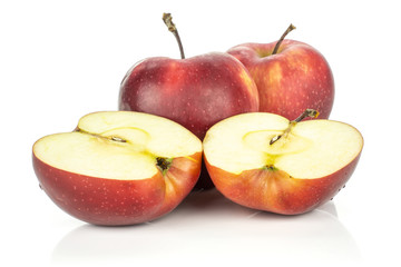 Naklejka na ściany i meble Two red delicious apples and two halves isolated on white background cross section.