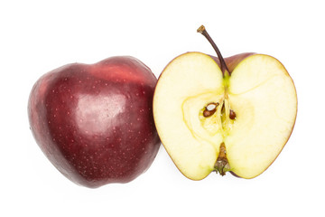 Red delicious apple two halves flatlay isolated on white background.