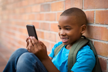 School boy using smart phone