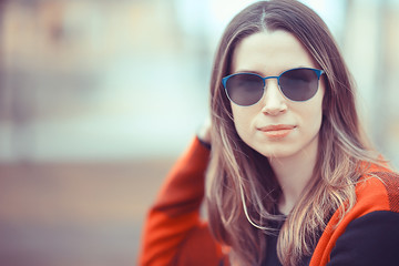 spring adult girl outdoor / March in Scotland, a girl in a plaid poses in the park