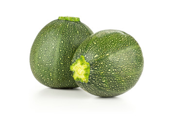 Two round zucchini isolated on white background fresh summer squash.