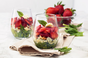 Spinach salad in glass.