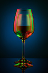 Coloful wineglass on table.