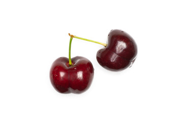 Group of two whole sweet bright red cherry with a stem flatlay isolated on white...........................................................................