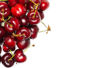 Sweet bright red cherry left upper corner flatlay isolated on white...........................................................................