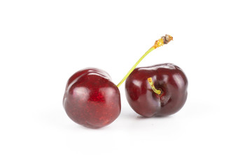 Group of two whole sweet bright red cherry isolated on white...........................................................................