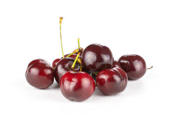 Sweet bright red cherry stack isolated on white...........................................................................
