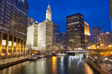 Fototapeta na wymiar The Chicago River in the evening during the Blue Hour with plenty of city lights.