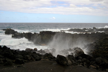 Reunion island seascape, landscape. Black sand, volcanic rocks.