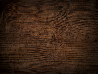 Fototapeta premium old scratched dark wooden board background