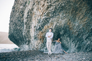 Beautiful young couple on wedding day near the sea.
