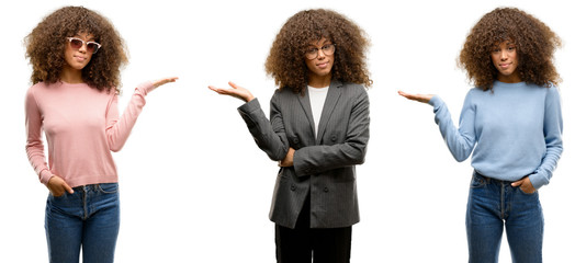 African american young woman wearing different outfits smiling cheerful presenting and pointing...