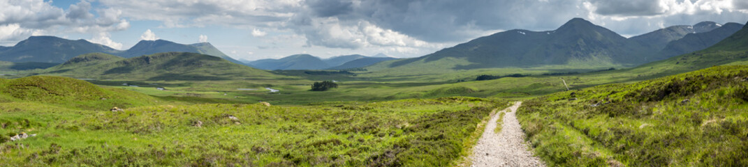 Fototapeta premium a view of the west highland way in the highlands of scotland during a bright summer day