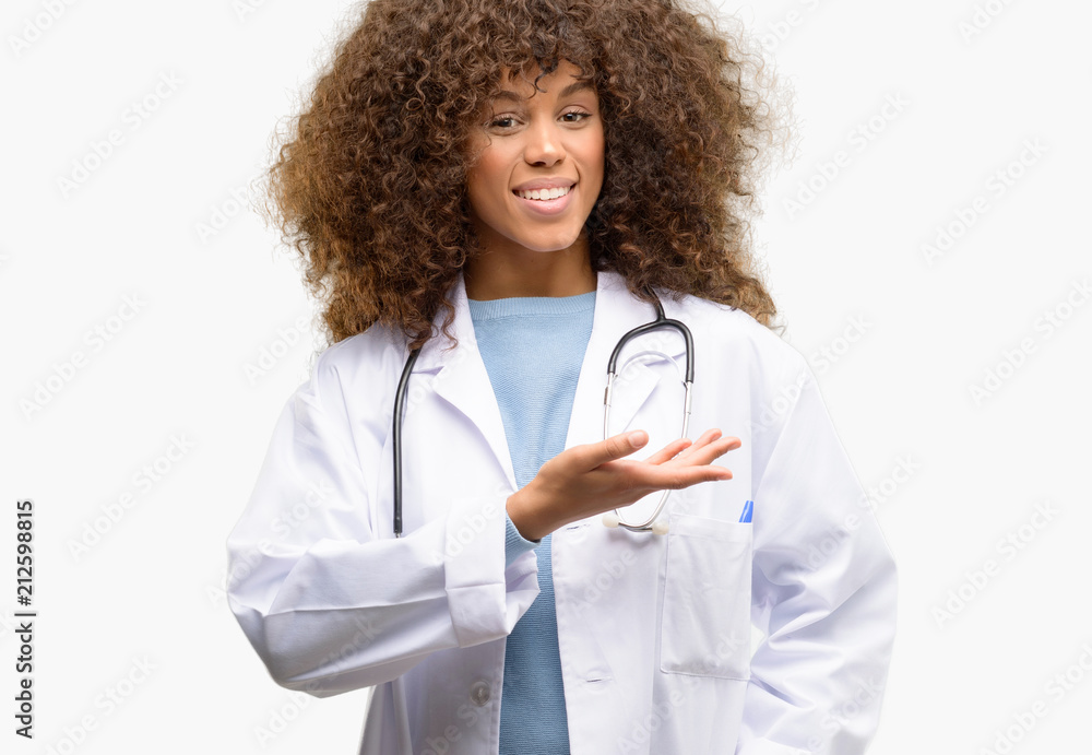 Wall mural african american doctor woman, medical professional working holding something in empty hand