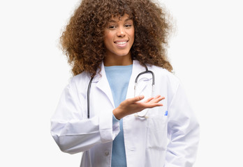 African american doctor woman, medical professional working holding something in empty hand