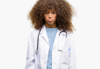 African american doctor woman, medical professional working with sleepy expression, being...