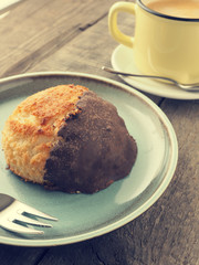 Tasty organic macaroon with cup of coffee