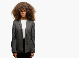 African american business woman wearing glasses skeptic and nervous, frowning upset because of...