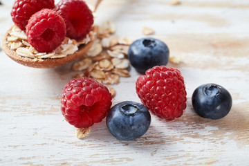 oatmeal porridge with raspberry and blueberry.