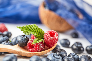 Ripe fresh raspberry and blueberry close up