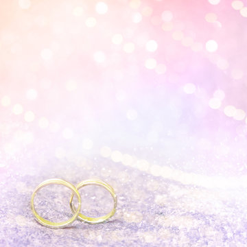 Pastel Pink Wedding Background With Golden Rings