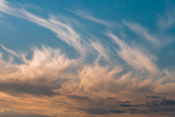 Naklejka na ściany i meble Beautiful clouds at sunset, warm summer evening