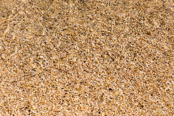 Structure of shallow water on sand from pink seashells, Crete, Elafonisi, sea, surf,