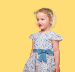 Beautiful blonde toddler gesturing