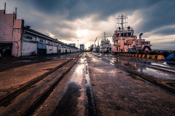 view of  a old condition port in a cloudy evening after rain