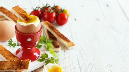 Fototapeta na wymiar Soft-boiled egg with toasts