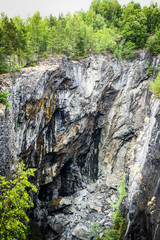 Old abandoned open-pit mining hole. Dannemora, Sweden