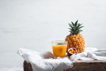 Pineapple and passion fruit juice In the White table background