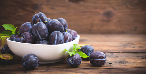 Fresh organic plums in the bowl